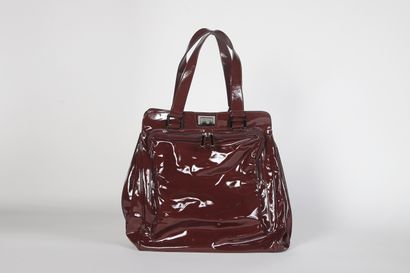 CÉLINE
Wine-red patent leather bag with double...