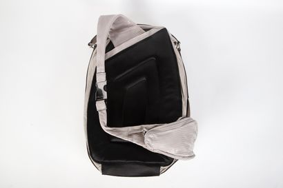 CÉLINE
Asymmetrical backpack in ecru reptile-effect...