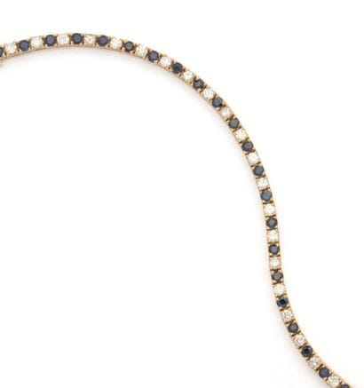 Bracelet tennis en or jaune 18K (750/1000)...