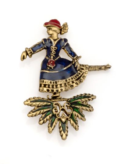 HERMES
Broche en métal doré et émail polychrome...