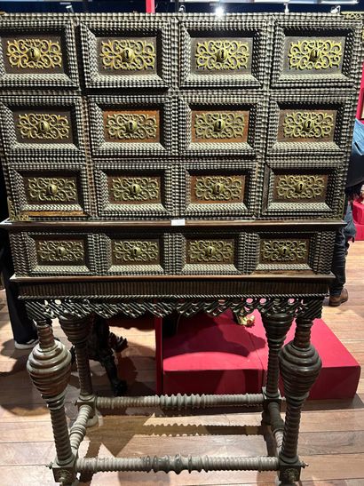 Contador cabinet, opening with nine drawers...