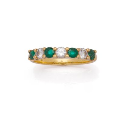 Demi-alliance en or jaune 18K (750/1000)...