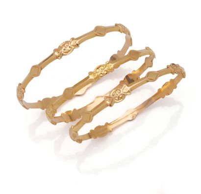 Three 18K (750/1000) yellow gold cutaway...