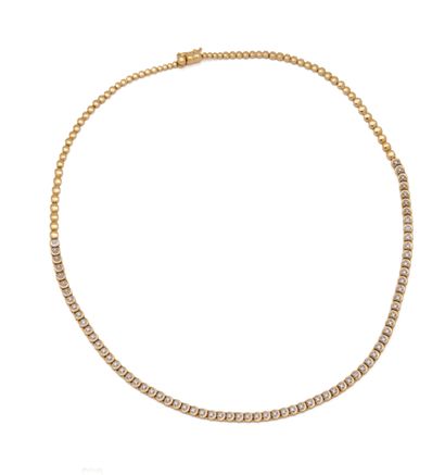 Collier style rivière en or jaune 18K (750/1000)...