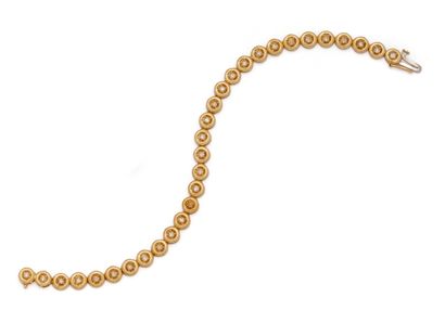 Bracelet ligne en or jaune 18K (750/1000)...