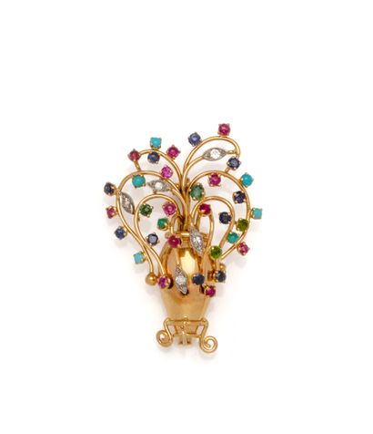 Broche en or 18K (750/1000) stylisant un...