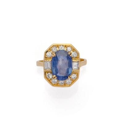 BAGUE en or jaune rhodié 18K (750/1000) centrée...