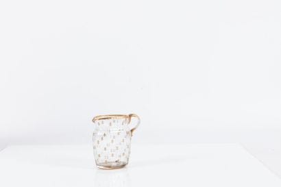 Daum

Pichet de forme aplatie en verre côtelé...