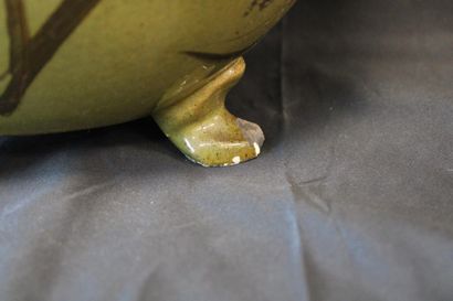 Oval planter with four feet, decorated with...