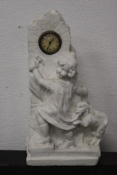 Sculpted plaster clock featuring a child...