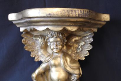 Gilded wood console with angel