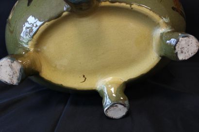 Oval planter with four feet, decorated with...