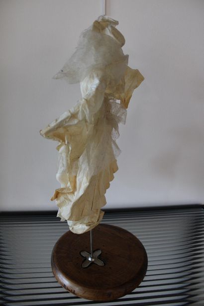 Paper figure on stand 