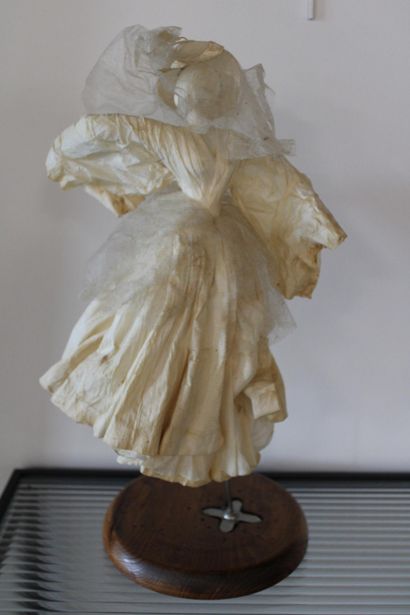 Paper figure on stand 