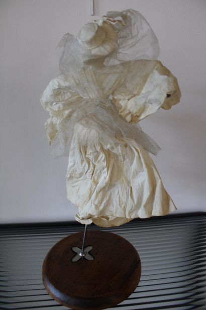 Paper figure on stand 