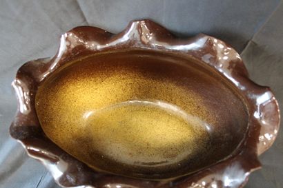 Oval planter with four feet, decorated with...