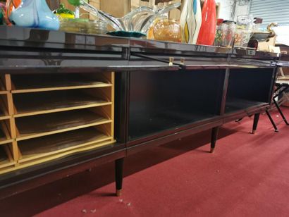 A lacquered wood enfilade with 3 sliding...