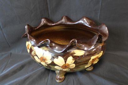 Oval planter with four feet, decorated with...