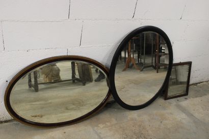 Set of three mirrors: one oval with brown...
