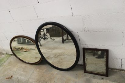 Set of three mirrors: one oval with brown...