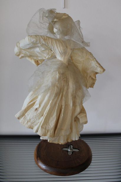 Paper figure on stand 