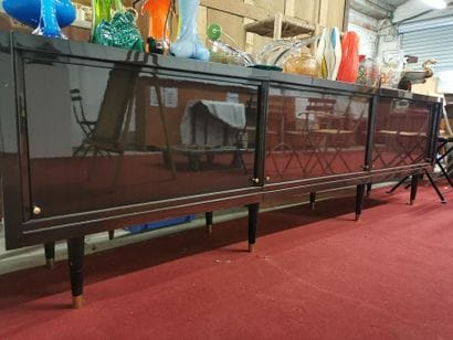 A lacquered wood enfilade with 3 sliding...