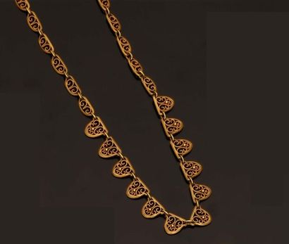 Collier en or jaune 18K (750 °/°°). Décor...