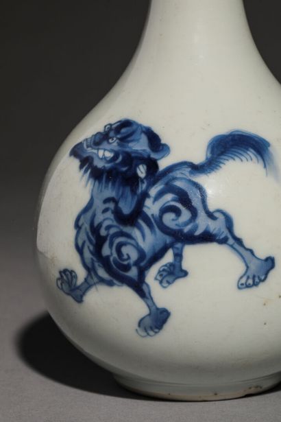 Bottle aspersorium in blue and white porcelain...