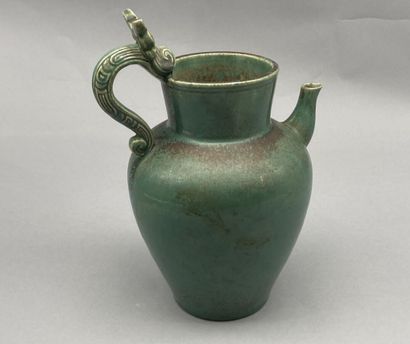 BIEN HOA. 

Stoneware pitcher with green...