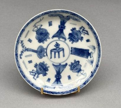 Small tea bowl and its saucer in blue and...
