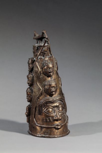 Conical bronze object decorated with various...