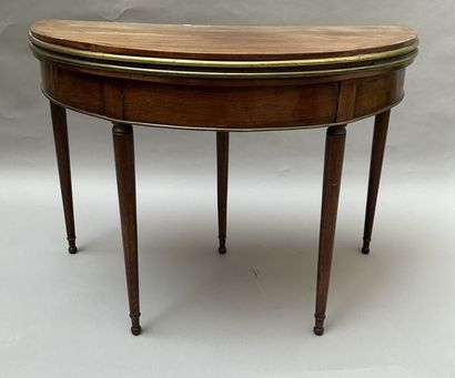 Mahogany and mahogany veneer half-moon table...