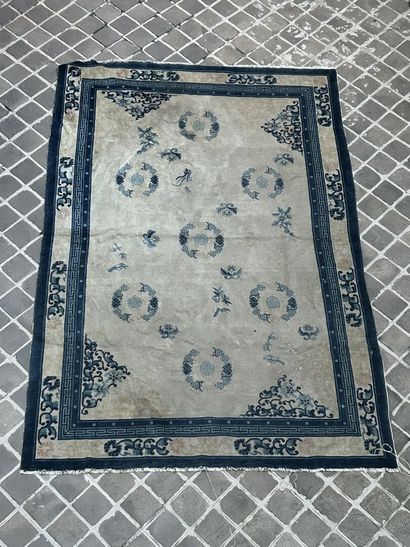 
Large carpet with cream background decorated...