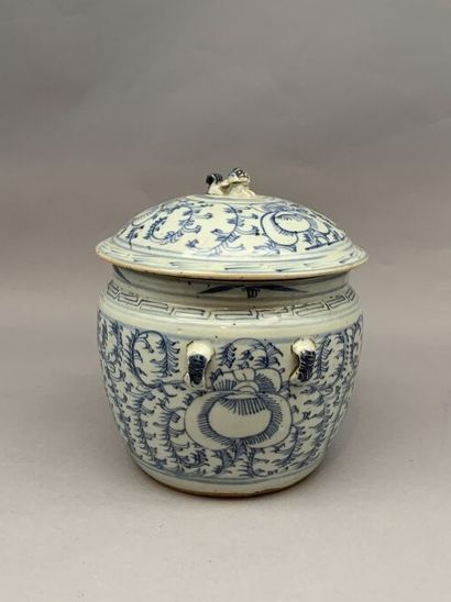 Covered pot with a flared body in porcelain....