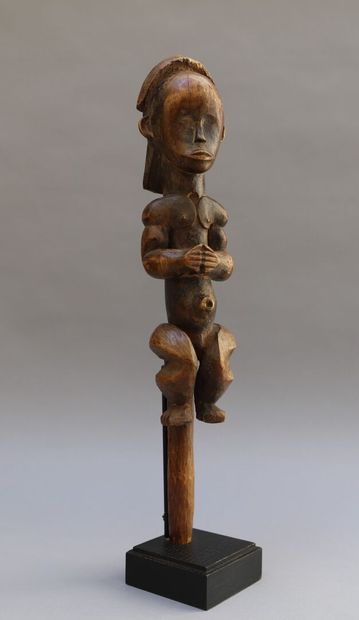 Seated statue of a reliquary box keeper in...