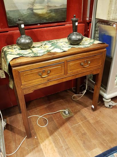 
Lot including: 

- A hardwood console with...