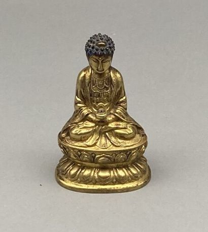 Buddha in gilt bronze, the headdress painted...