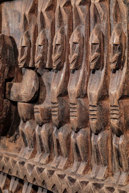 Wooden door of a hut carved with Nommo and...