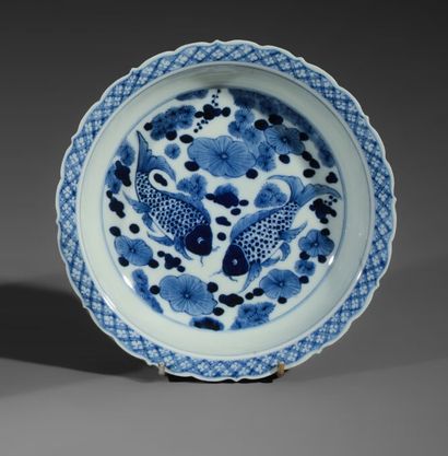 
Circular hollow dish with contoured edges...