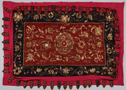 Large embroidery on a red cotton background....