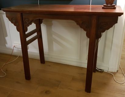 Straight console in molded and carved hardwood....