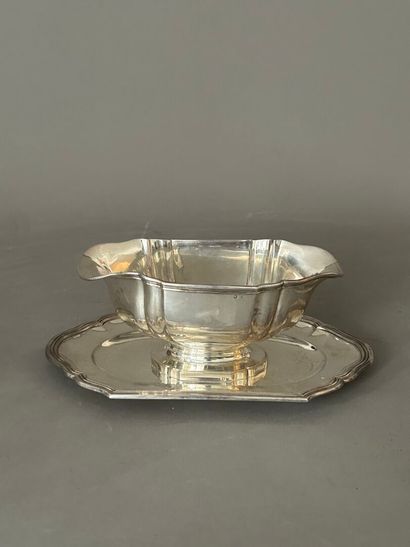 Oval silver sauceboat with two pourers on...