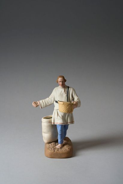 Polychrome bisque FIGURINE depicting a sower,...