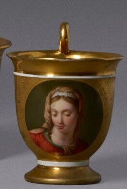 A domed porcelain cup on a cylindrical base...