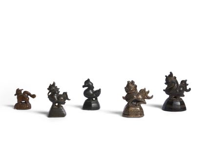 Reunion of five opium weights in brown patina...