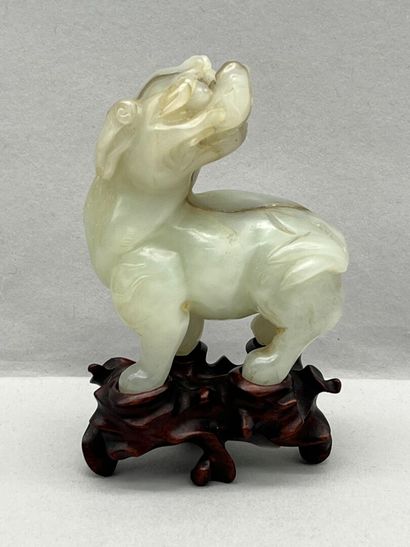 Celadon jade subject depicting a qilin, head...