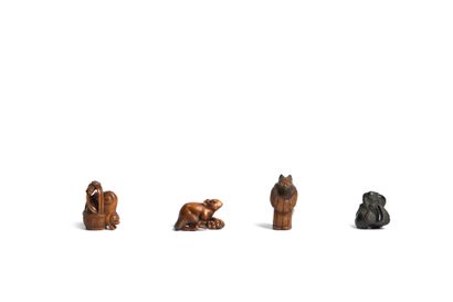 Meeting of four wooden netsukes including:...