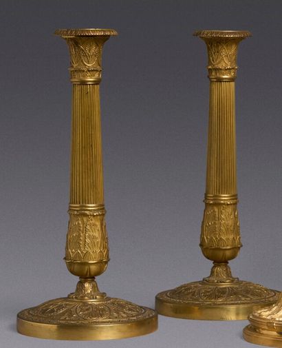 Pair of torches in chased and gilded bronze....