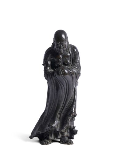 Bronze subject with brown patina depicting...