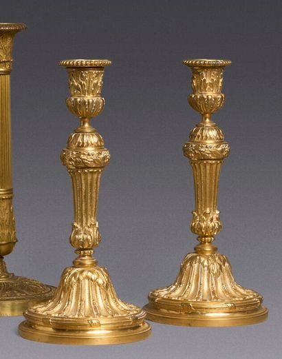 Pair of torches in chased and gilded bronze....